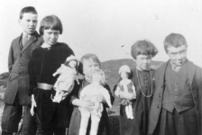 411: l-r Vince, Mollie, Cede, Anne and Gerry McCarthy. The girls have ""store bought"" dolls.  (circa 1930)  - children of James McCarthy &amp;amp; Julia Reddy